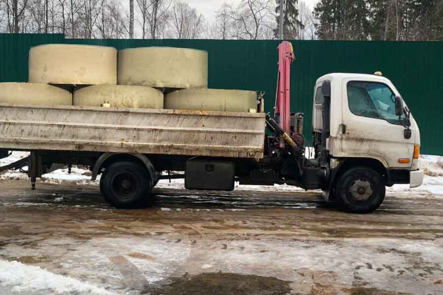 Услуга перевозки бетонных колец манипулятором